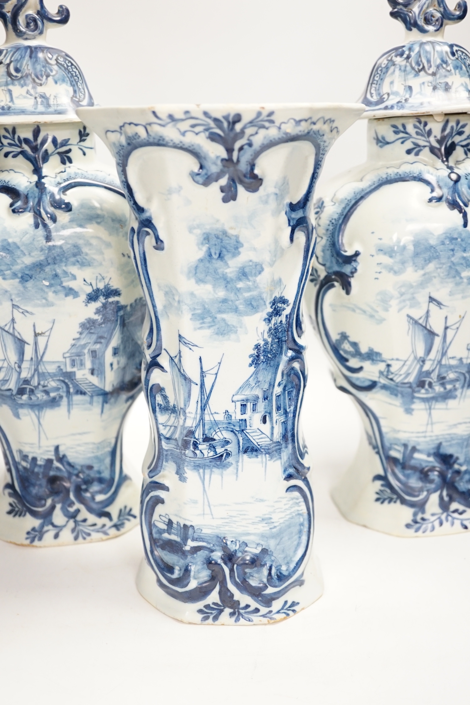 A Delft garniture of three vases, c.1770, tallest 41cm high